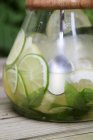 Closeup view of Limeade in a glass jug — Stock Photo