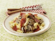 Fusilli pasta with salami — Stock Photo