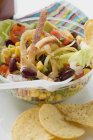 Mexican salad with tortilla chips to take away in box — Stock Photo