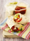 Closeup view of chicken wraps with dips — Stock Photo