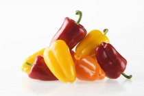 Red with yellow and orange peppers — Stock Photo