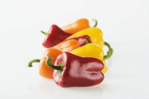 Red with yellow and orange peppers — Stock Photo