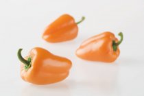 Fresh orange peppers — Stock Photo