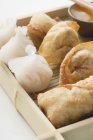 Closeup view of Dim Sum and Spring rolls on bamboo tray — Stock Photo