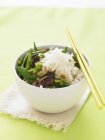 Beef with peas and rice — Stock Photo