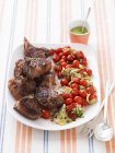 Lamb chops with fried tomatoes — Stock Photo