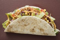 Taco filled with mince — Stock Photo