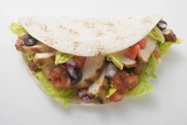 Closeup view of chicken Taco on white surface — Stock Photo