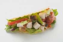 Closeup view of one chicken Taco on white surface — Stock Photo