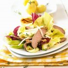 Mixed salad leaves with lamb — Stock Photo
