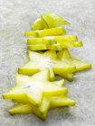 Closeup view of carambola star-shaped slices — Stock Photo