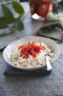 Rice with diced tomatoes — Stock Photo