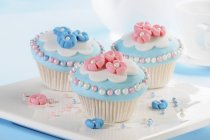 Cupcakes decorated with marzipan flowers — Stock Photo