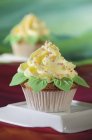 Cupcake with yellow frosting — Stock Photo
