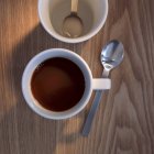 Cup of coffee with spoon — Stock Photo