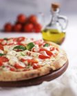 Pizza Margherita with basil — Stock Photo