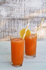 Closeup view of papaya drinks with orange — Stock Photo