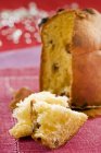 Closeup view of sliced Panettone on red cloth — Stock Photo