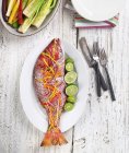 Whole Cooked Snapper Garnished with Vegetables — Stock Photo
