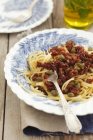 Spaghetti pasta with dried tomatoes — Stock Photo