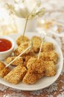 Chicken pieces with sesame crust — Stock Photo