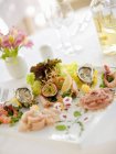 Closeup view of decorative starters of fish and seafood — Stock Photo