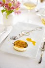 Passionfruit cheesecake on plate — Stock Photo