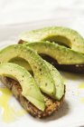 Sliced Avocado on Bread — Stock Photo