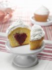 Cupcake with red velvet heart center — Stock Photo