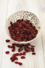 Dried barberries in bowl — Stock Photo