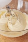 Closeup view of mixing cake batter with in glass bowl — Stock Photo