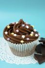 Cupcake with chocolate icing — Stock Photo