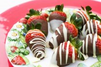 Strawberries decorated with chocolate — Stock Photo