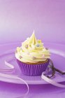 Cupcake with colorful sugar stars — Stock Photo
