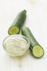 Two cucumbers and dish — Stock Photo