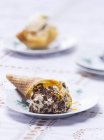 Ice cream cone on plate — Stock Photo