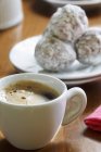 Closeup view of Espresso with Mexican wedding cookies — Stock Photo