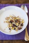 Muesli with raisins and yoghurt — Stock Photo