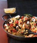 Paella rice dish with seafood — Stock Photo