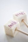 Marshmallows decorated with writing — Stock Photo