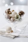 Christmas tree baubles in glass dish — Stock Photo