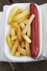 Top top view of Saveloy sausage with chips — Stock Photo