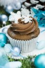 Cupcake decorated with snow flakes — Stock Photo