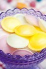Closeup view of Flying saucer candies in glass dish — Stock Photo