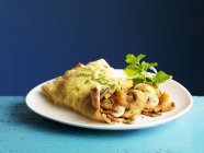 Crepes stuffed with mushrooms — Stock Photo