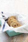 Walnut-cranberry cookies in blue box — Stock Photo