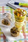 Muffins and yogurt with fruits — Stock Photo