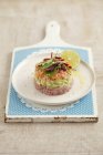 Tuna and salmon tartar with avocado — Stock Photo