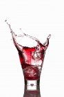 Campari spilling out glass — Stock Photo