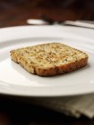 Closeup view of a piece of toast on a white plate — Stock Photo
